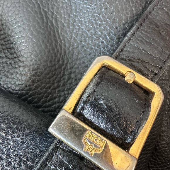 MCM Black Leather Drawstring Shoulder Backpack with Gold Accents - Picture 6 of 11